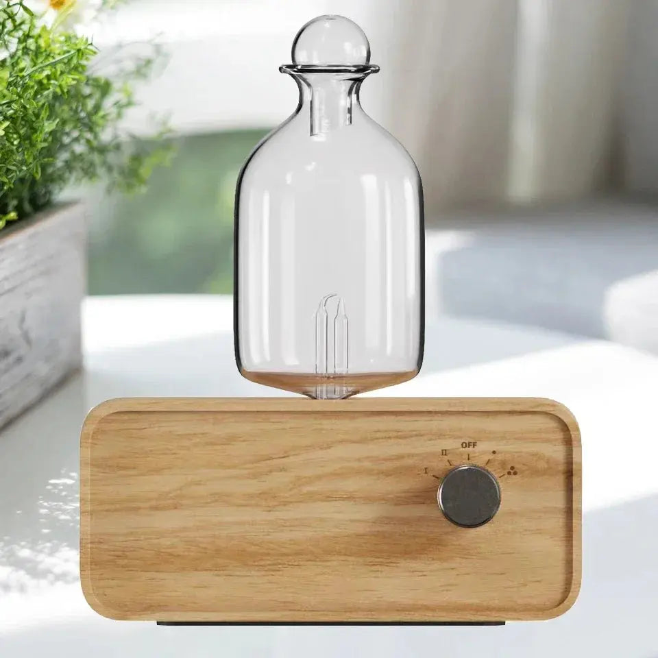 Diffuseur d’huiles essentielles design avec base en bois et récipient en verre