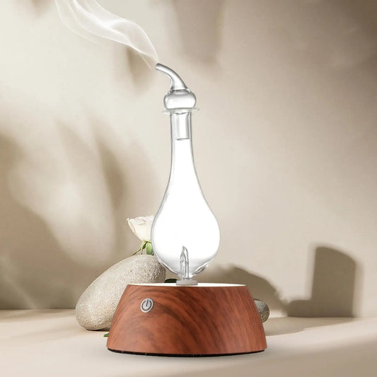Diffuseur à nébulisation sans eau en bois avec base en verre et design élégant.