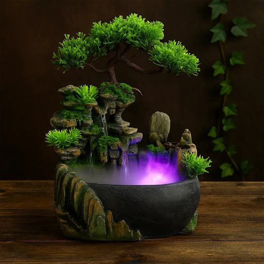 Fontaine décorative bonsaï avec brume et éclairage LED violet, posée sur table en bois sombre