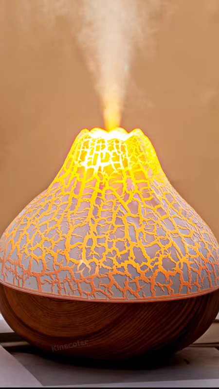 Rituel bien-être avec diffuseur d’huiles essentielles ultrasonique et accessoires de méditation.